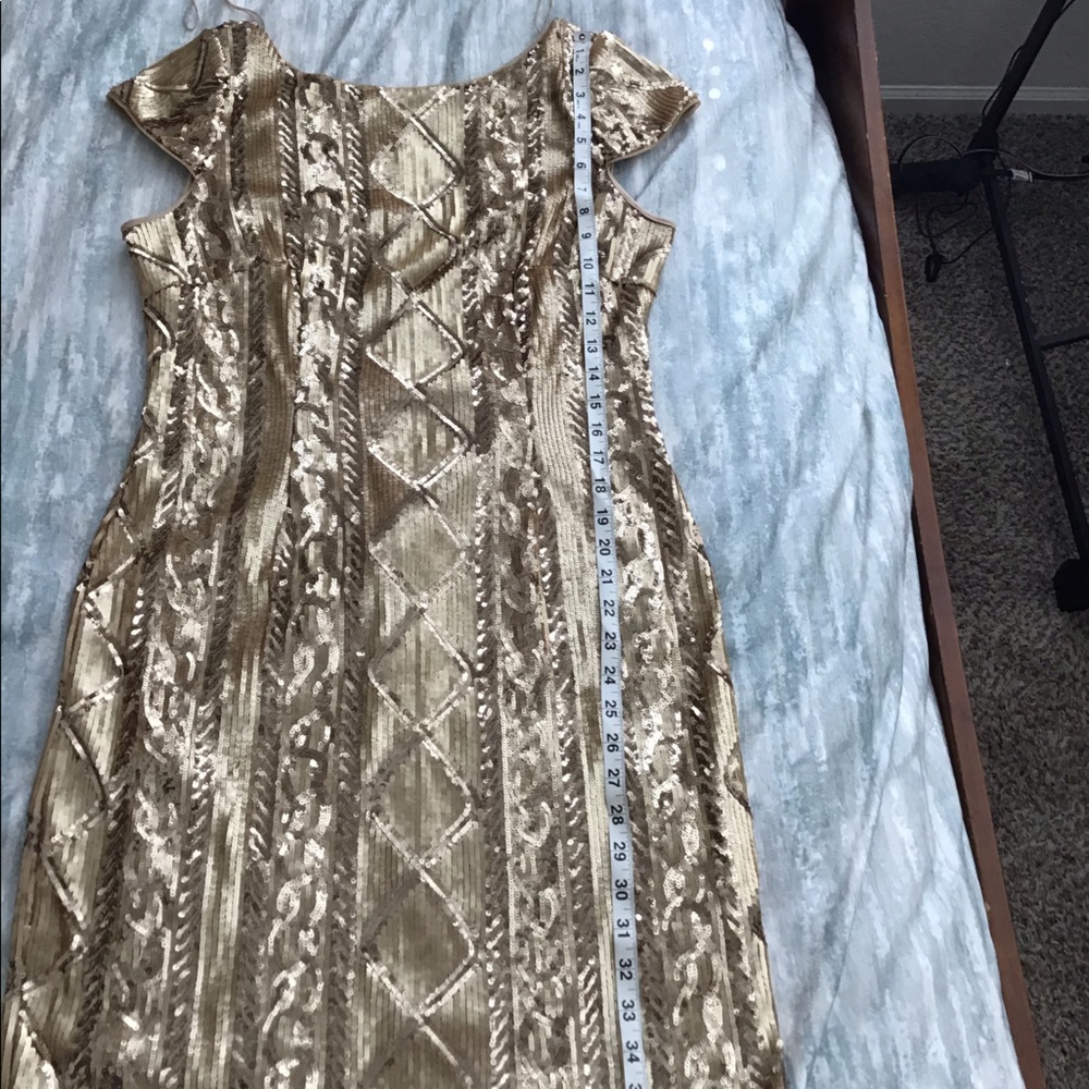 Gold sequined party dress.